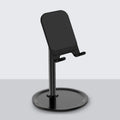 Aluminium alloy mobile phone and tablet stand in black or white on a desk