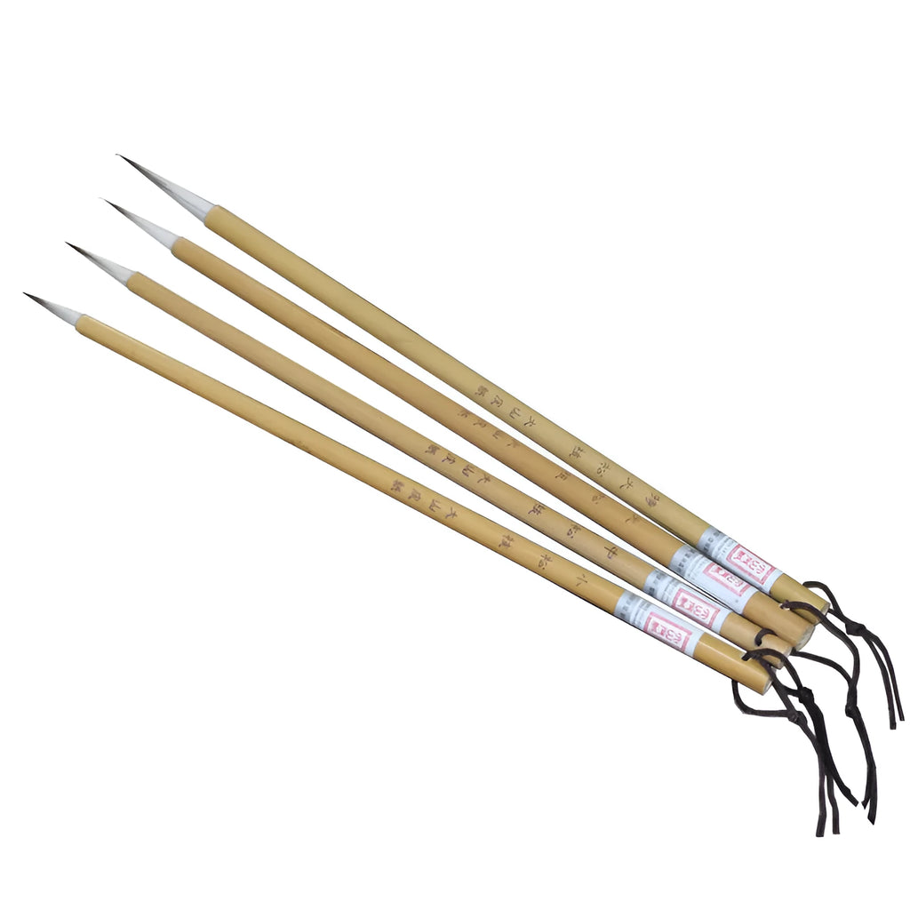 Four Chinese calligraphy brushes with thin gold bodies and natural hair bristles in pine branch colours