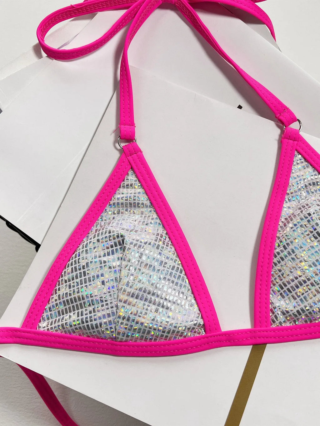 Silver women's split triangle bikini top on a white background.