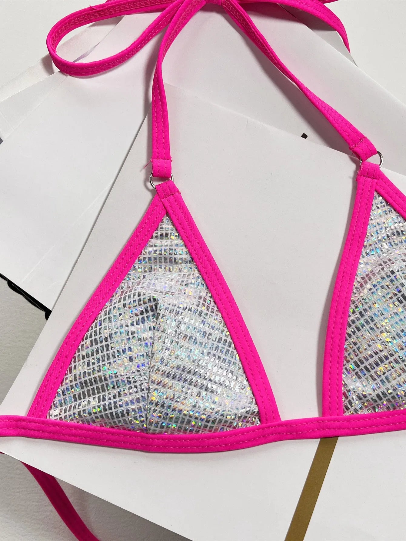 Silver women's split triangle bikini top on a white background.