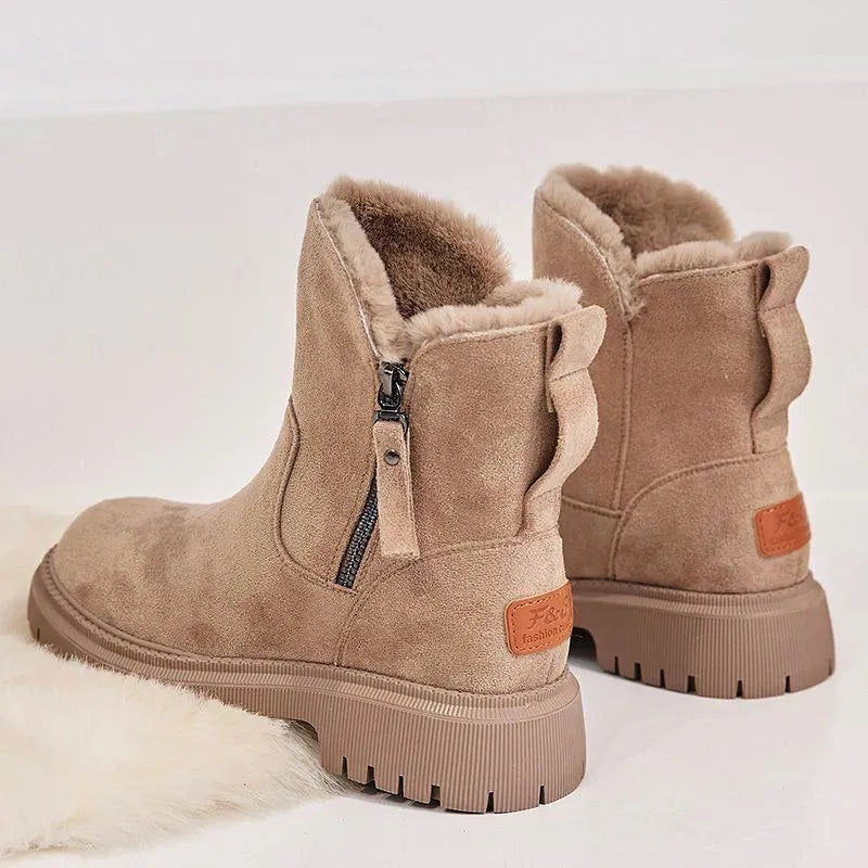 Women's black faux suede high-top snow boot with side zipper on a non-slip rubber sole.