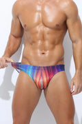 Men's printed polyester swimming trunks on a size chart, showing colour options: Cyber, Ice Cream, Streamer, Skull.