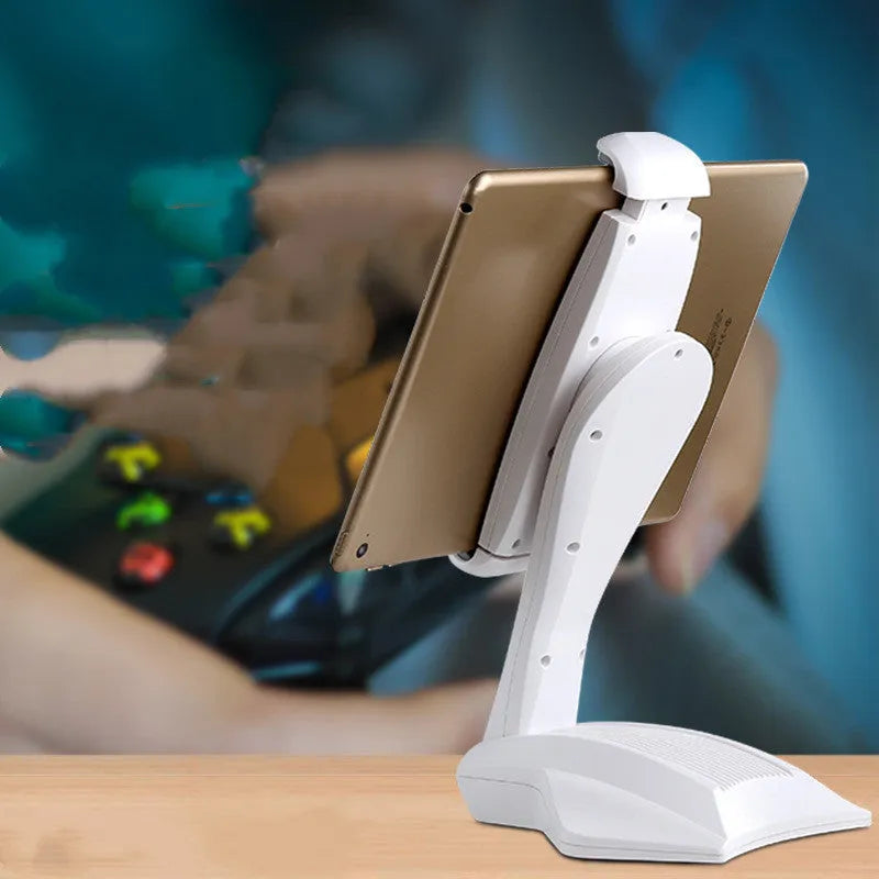 White adjustable tablet stand with metal frame and silicone clip, holding a tablet on a desk.