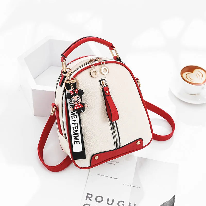 PU leather women's backpack with car suture design, oval shape, and internal zipper pocket