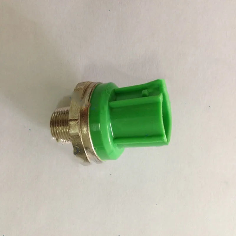 Knock sensor car engine replacement part with metal and plastic green housing