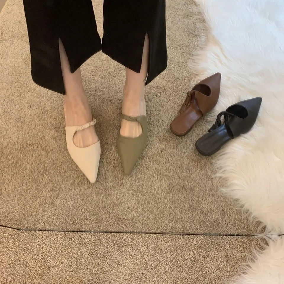 Women's soft leather-lined semi-toe box slippers with a rubber sole in dark brown.