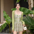 Pink floral one-piece women's swimsuit with suspenders, shown with matching smock.