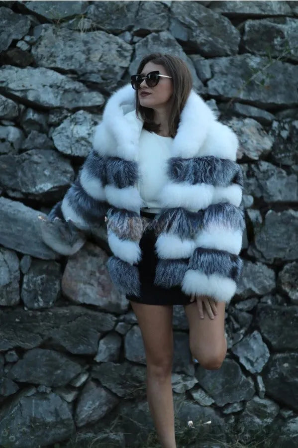 Women's loose artificial fur hooded coat in brown on a model, showing street fashion style.