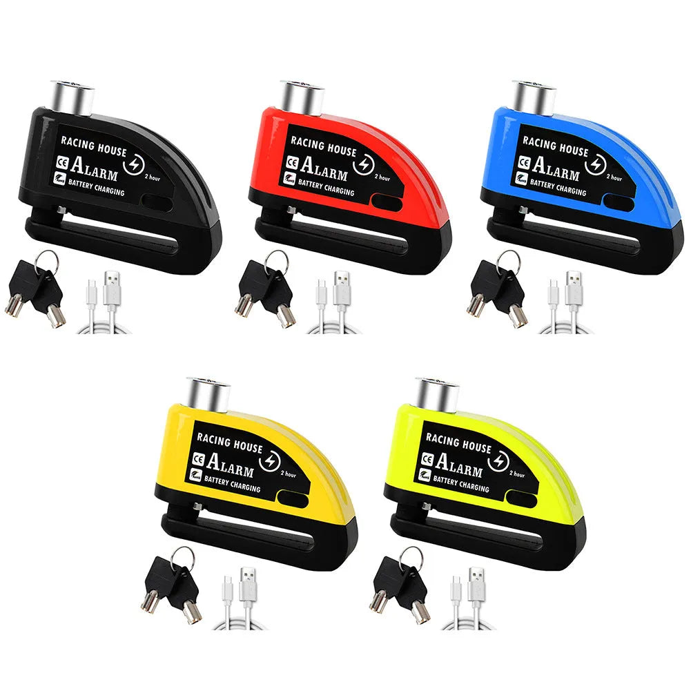 Black metal bicycle disc brake lock with red alarm button and warning cable rope on a bike disc brake