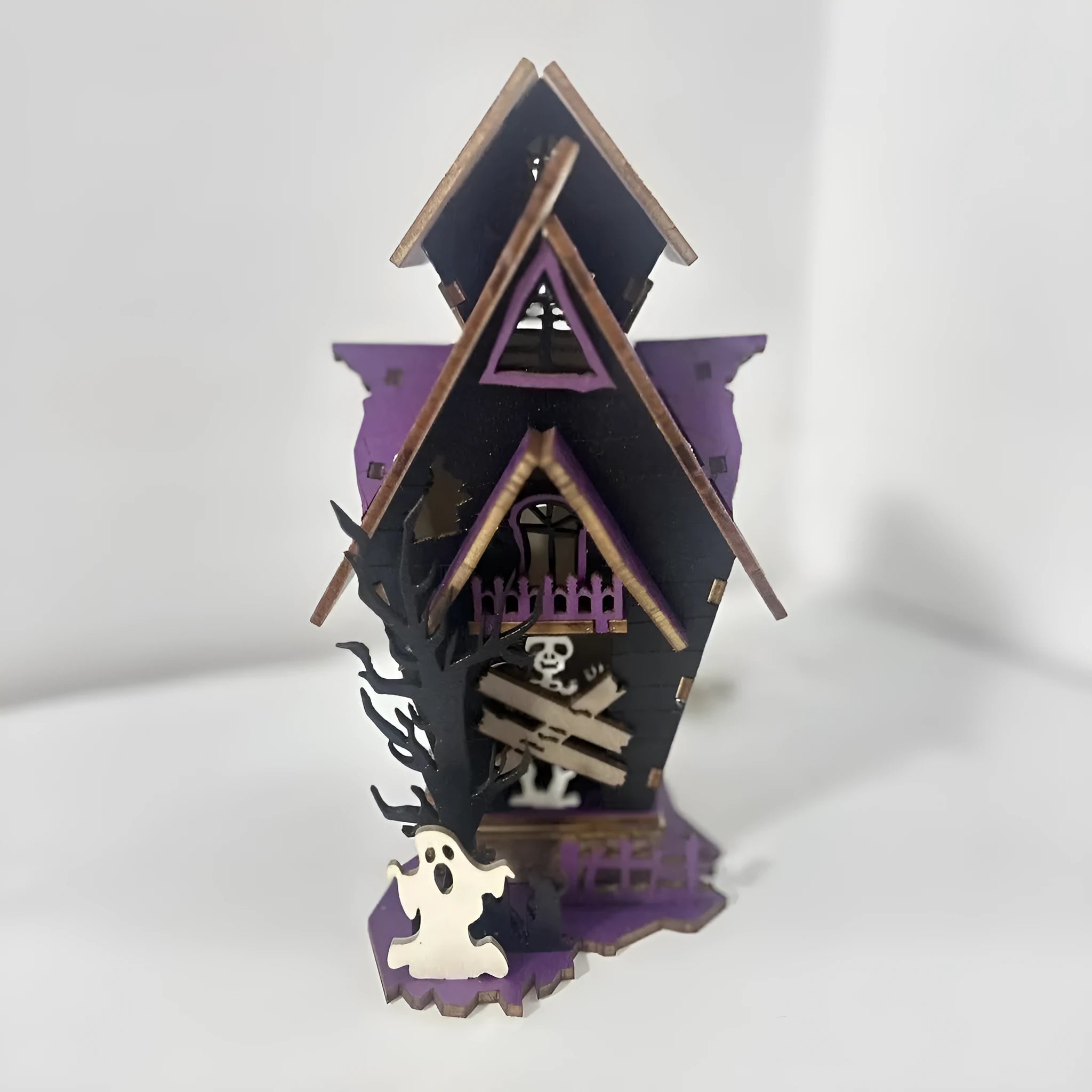 Wooden DIY glowing haunted house Halloween table decoration with luminous details