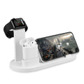 White aluminium wireless charging stand holding phone, headphones and smartwatch