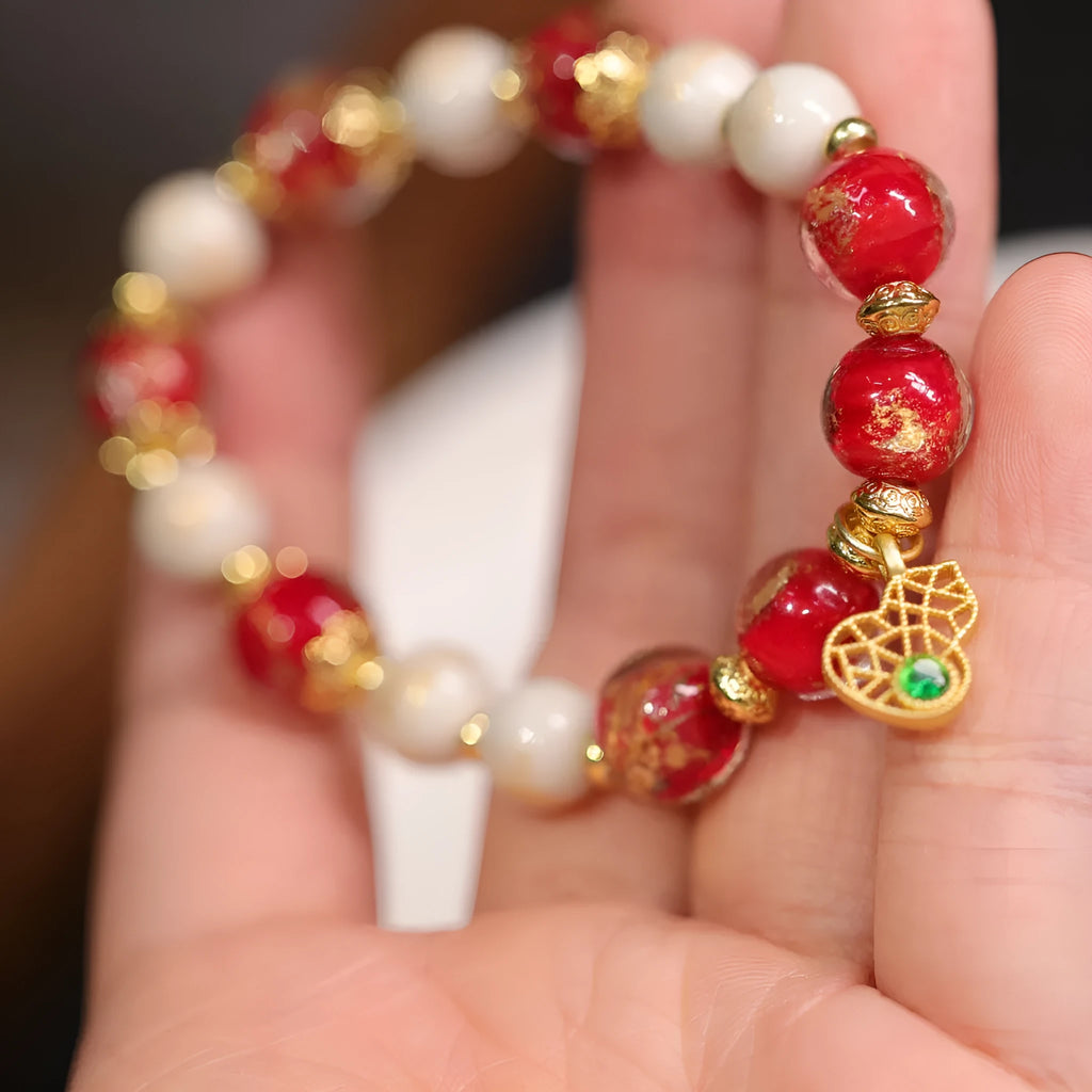 Women's ethnic style geometric bracelet with gold foil coloured glaze in Xingshi design