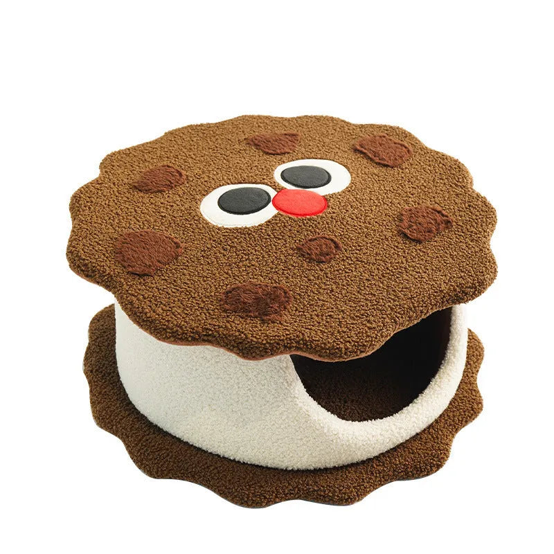 Khaki-coloured enclosed cat nest bed shaped like a sandwich cookie with a high entry wall.
