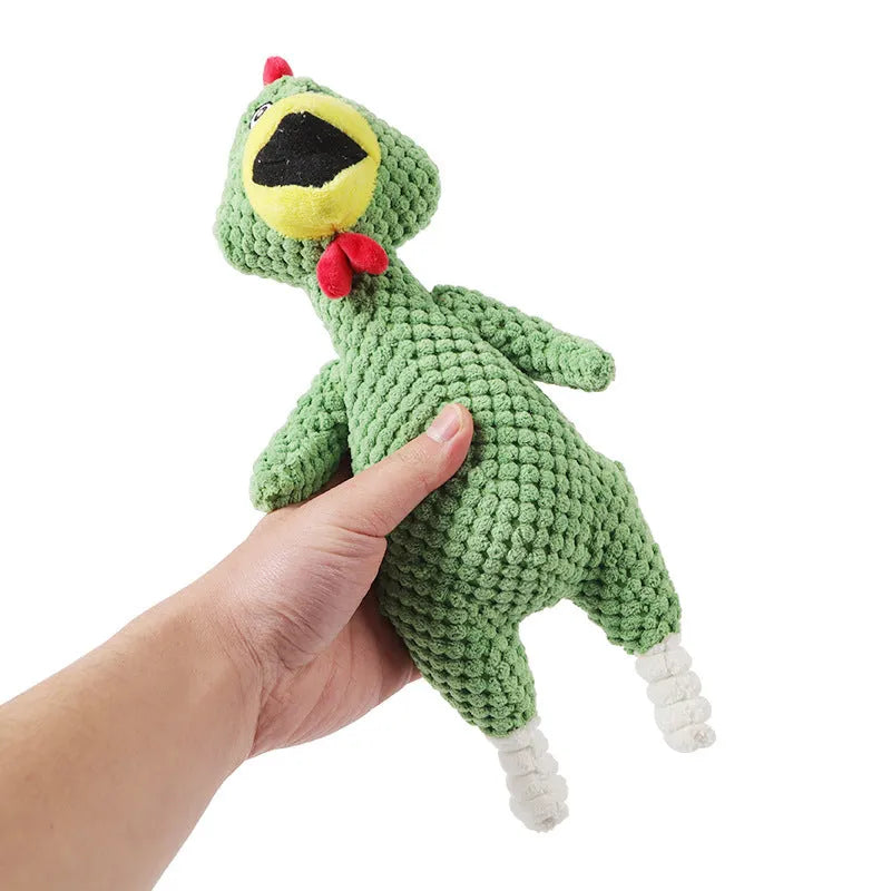 Soft pineapple fleece squeaker dog toy in yellow, green, and pink on a plain background