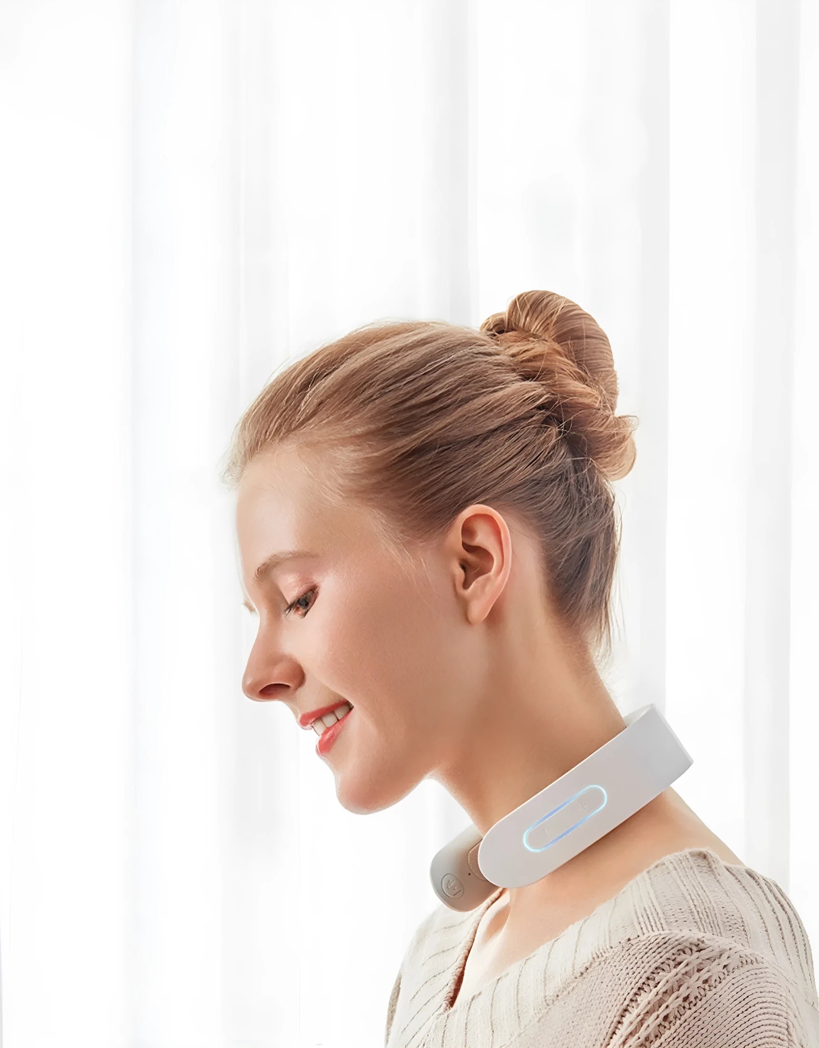 White electric full body acupressure massager with stainless steel nodes on a grey background.