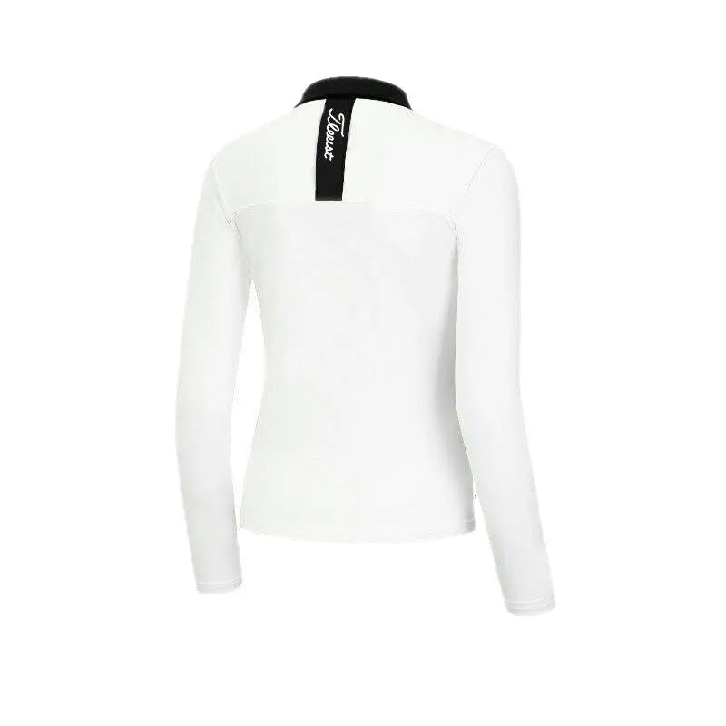 Women's white long sleeve slim fit golf top made of breathable polyester fabric.