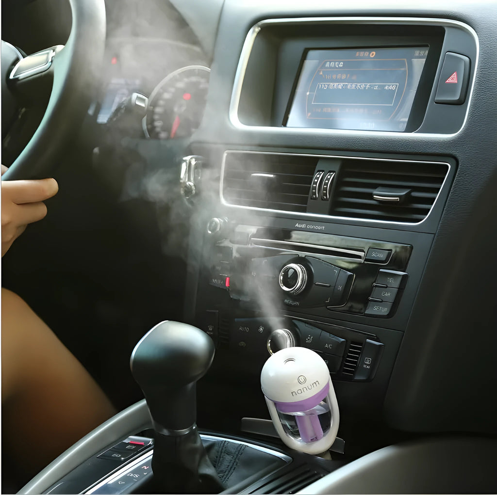 Compact portable car humidifier in blue, green, pink or purple with 180-degree rotation spray head
