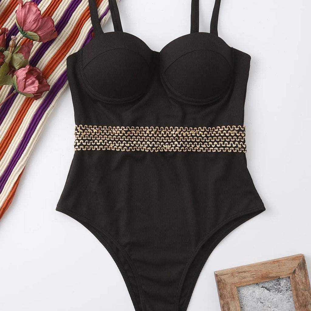 Black one-piece swimsuit with adjustable shoulder strap on a mannequin
