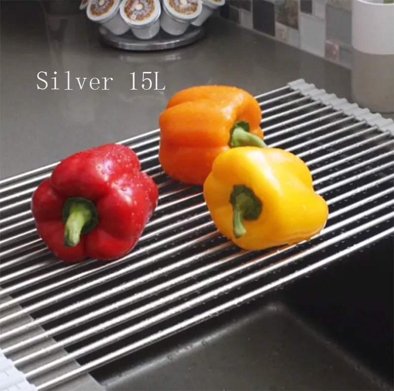 Folding stainless steel kitchen sink drying rack in red colour, shown extended for use.