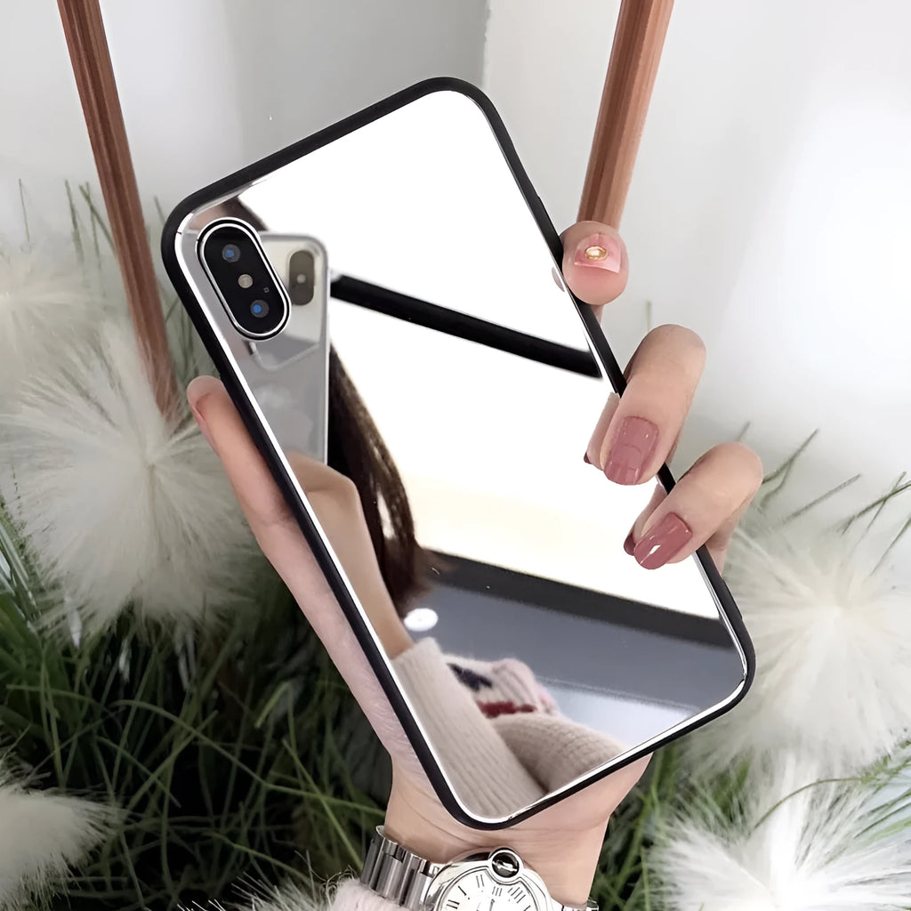 Black mirror phone case for Apple iPhone models X, 7 Plus, and 8 Plus on a table.