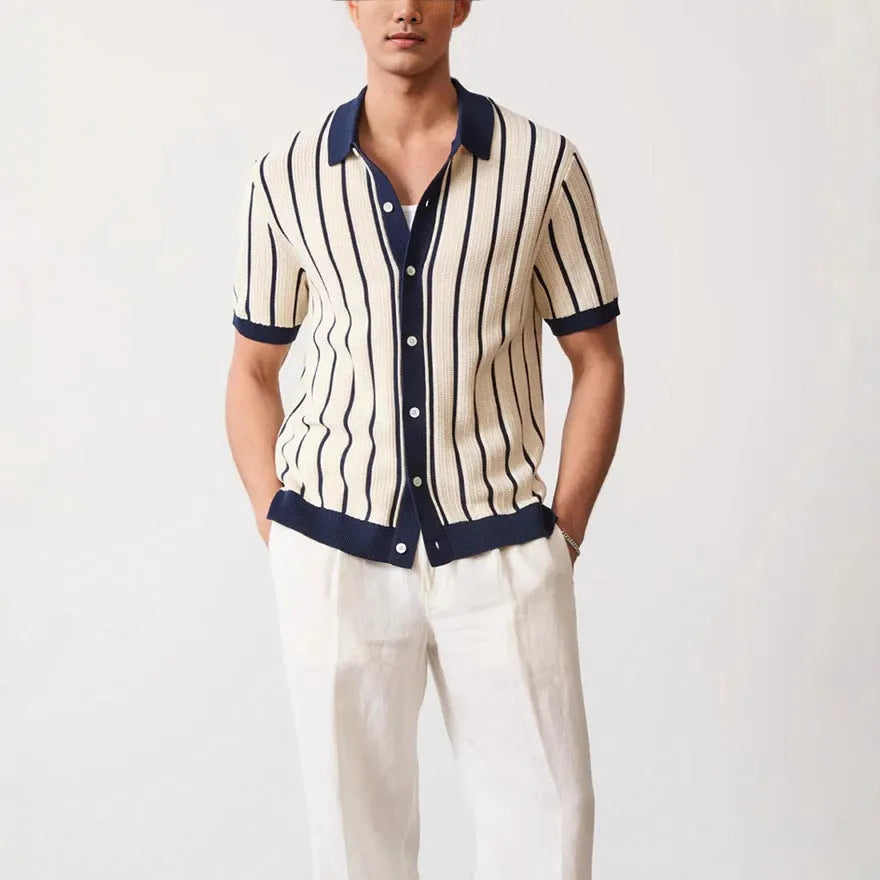Men's white asymmetric lapel knit top with short sleeves on a model.