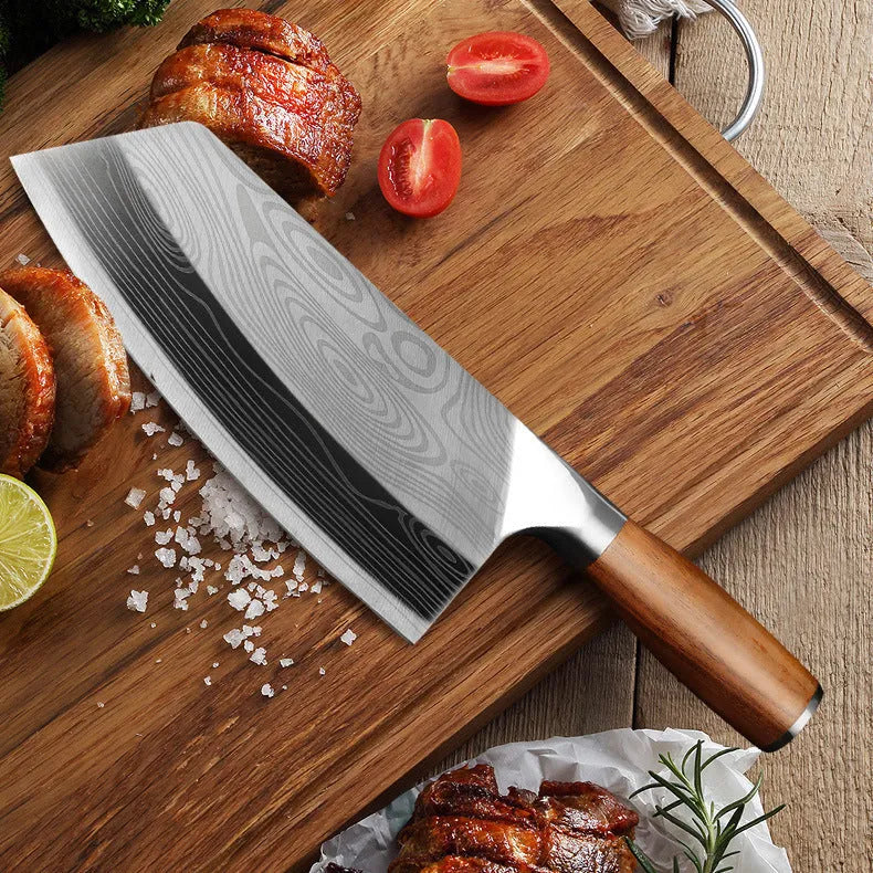 Forged stainless steel kitchen knife with a 320mm blade on a wooden cutting board.