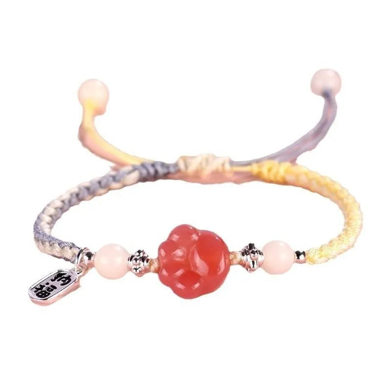 Handmade glass cat paw couple bracelet with red charm on pink or yellow woven cord