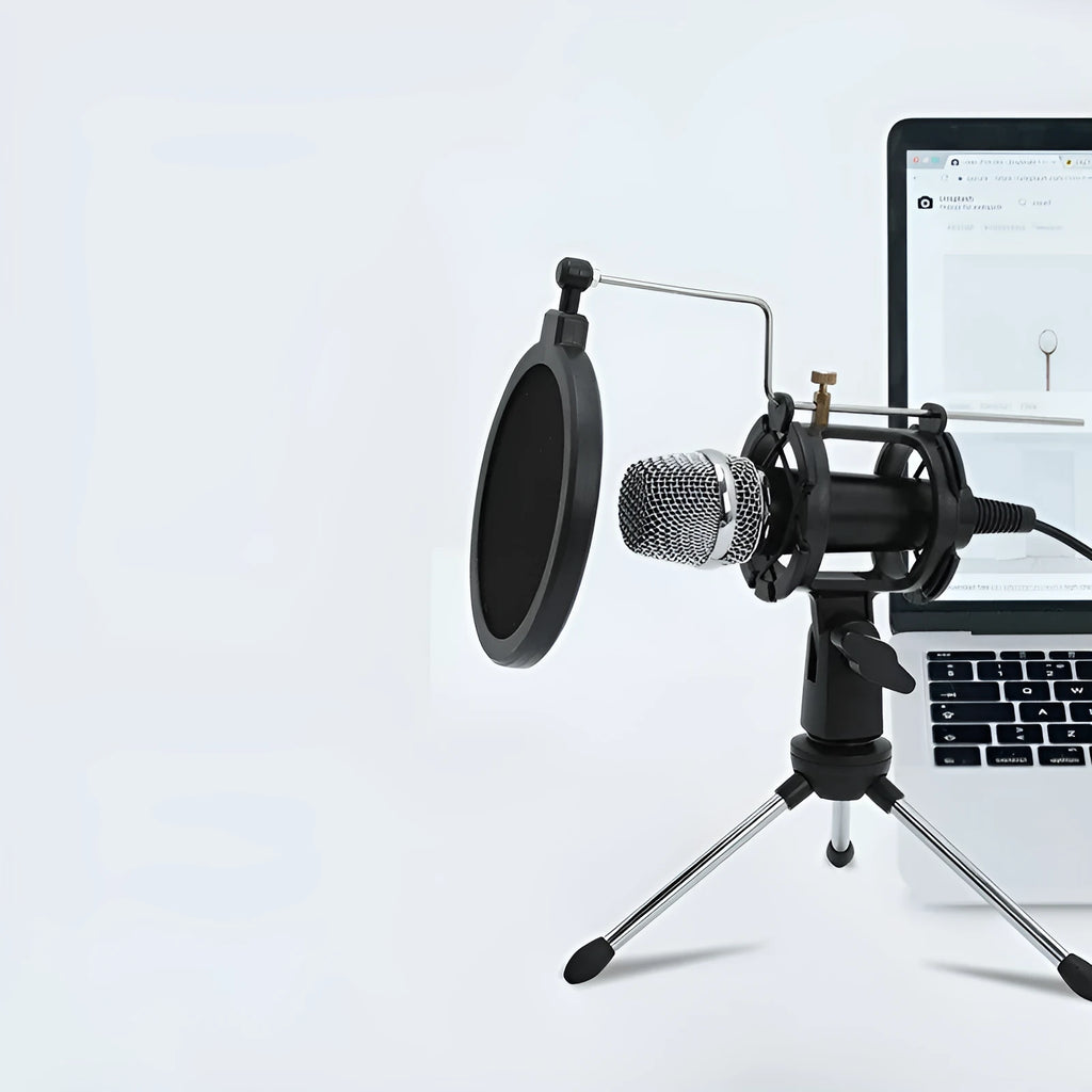 Black or silver condenser microphone on aluminium stand with 3.5mm and USB cables for mobile phone and computer broadcasting
