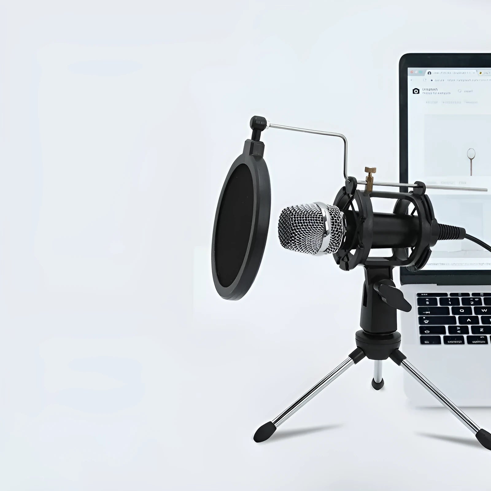 Black or silver condenser microphone on aluminium stand with 3.5mm and USB cables for mobile phone and computer broadcasting
