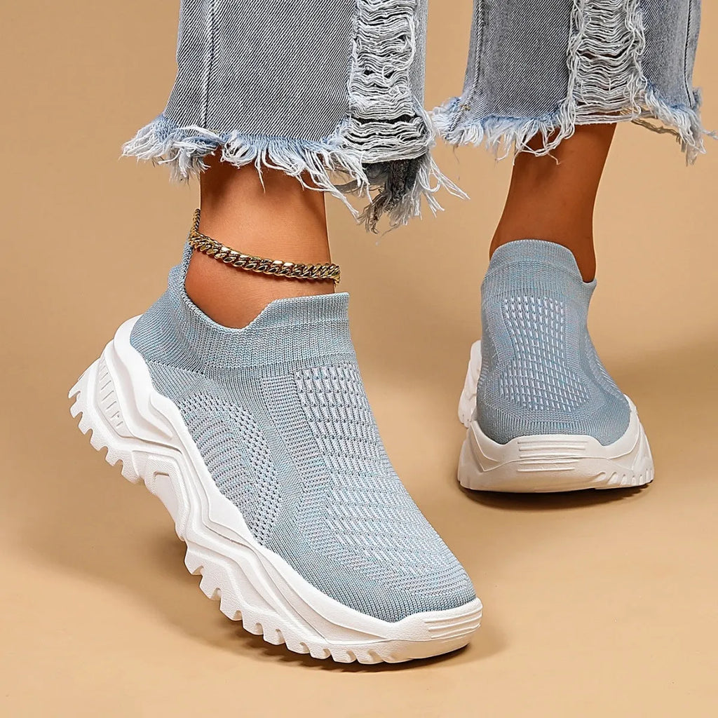 Women's light blue mesh slip-on sports shoes with round toe and mid heel