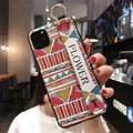 Rose flower printed clear phone case with built-in wrist strap for Apple iPhone models.
