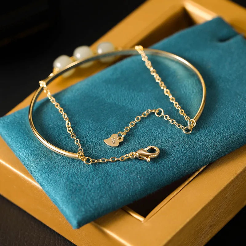 Hetian jade lucky beads bracelet with gold inlay treatment in single, double, or three beads version