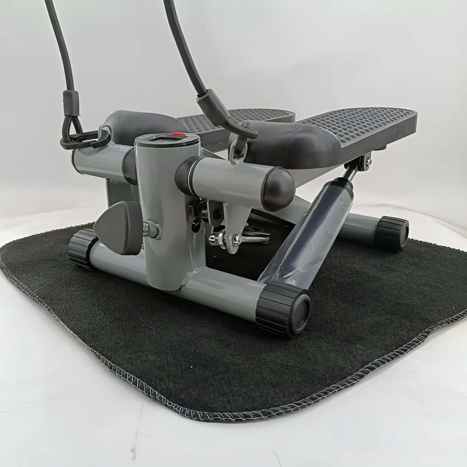 Silver grey hydraulic mini treadmill for home waist slimming fitness.