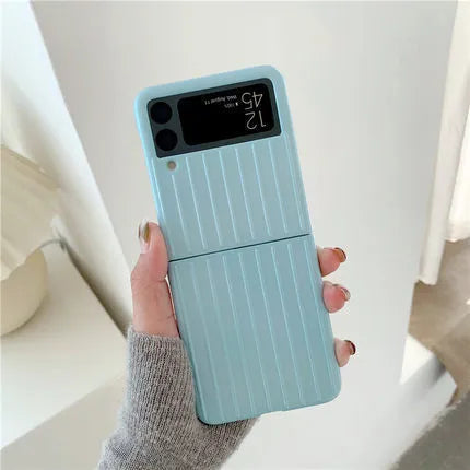 Samsung Z Flip3 folding phone in a slim, solid-colour flip case showing front and back views.
