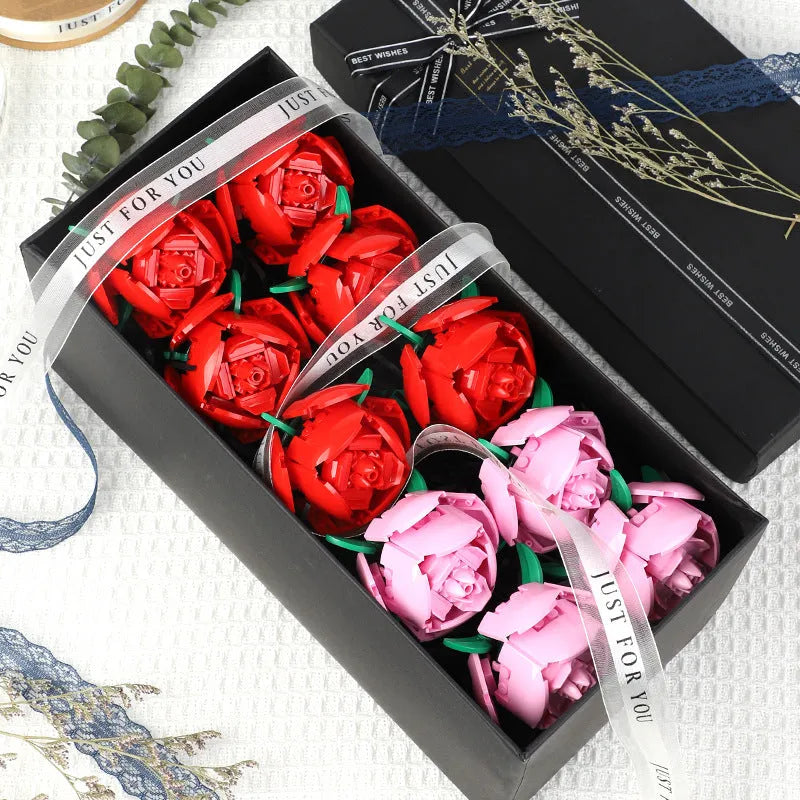 Rose assembled from small particle plastic building blocks in pink, red, or blue