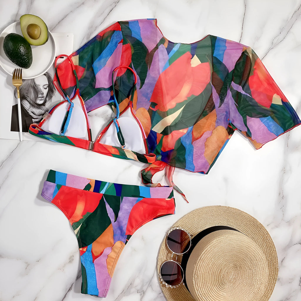 Red women's split-style swimsuit with a printed pattern, for swimming and surfing.