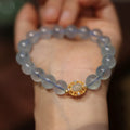 DIY kit components for an aquamarine fox Fengjiu bracelet with pearl and pink crystal beads.