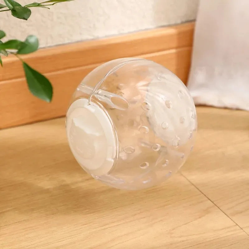 Blue ABS plastic cat slow feeder ball toy with visible treat holes on a white background.