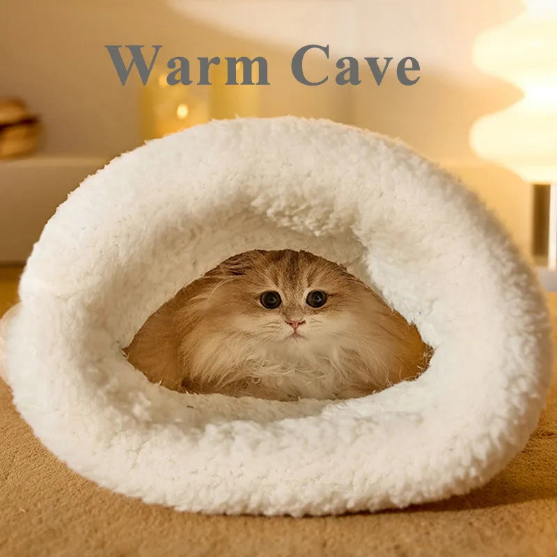 Fleece cat sleeping bag nest in light brown colour with a 3D entrance, shown on a wooden floor.