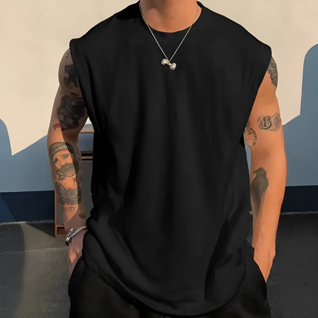 Men's loose sleeveless cotton tank top in a solid colour on a hanger
