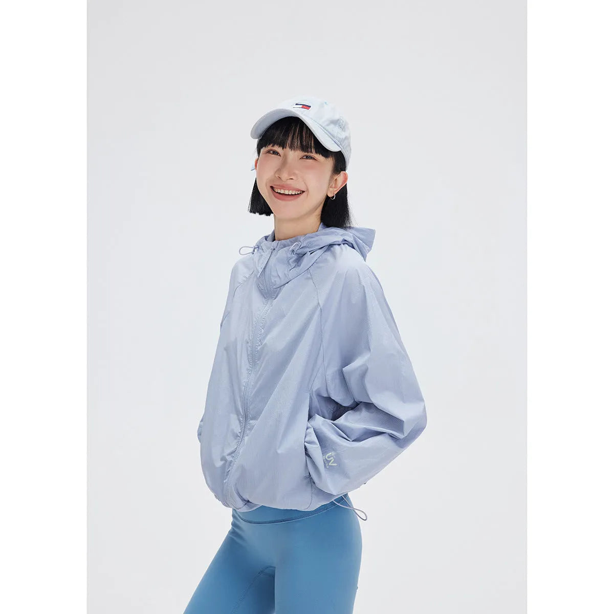 Men's thin hooded sports coat in chemical fibre blend on a hanger.