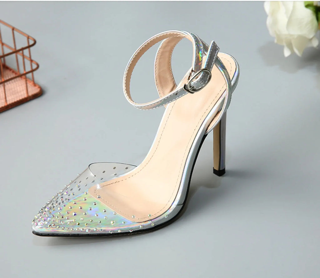 Women's pointed toe stiletto sandals with a diamond detail on a glossy PVC upper.