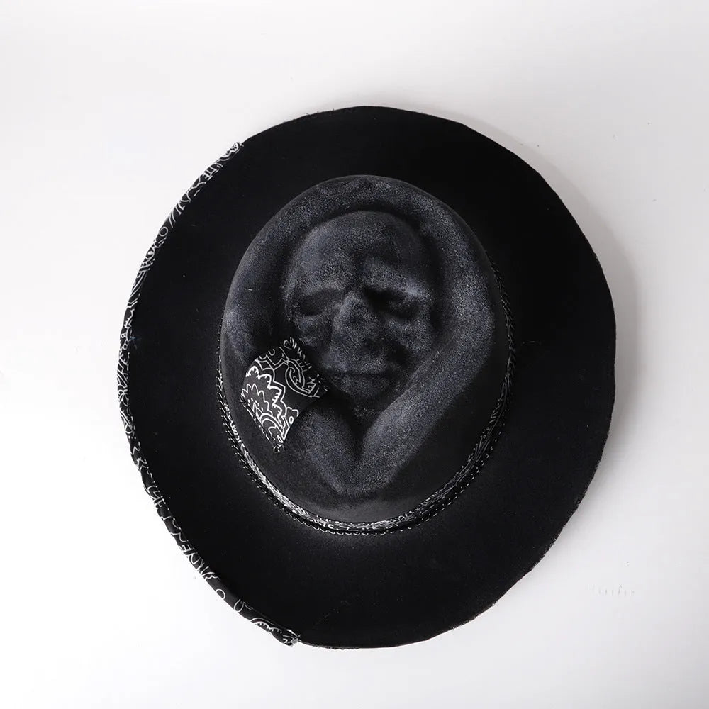 Handmade black wool felt skull hat with a tall pointed conical crown for Halloween costumes.