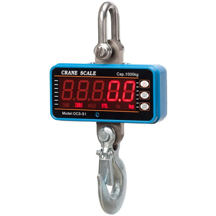 Orange electronic crane scale with digital display for 500 kg loads in warehouse.