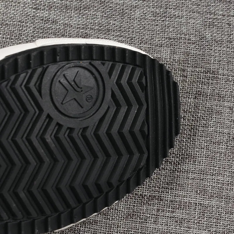 Velcro student canvas shoes high top with canvas upper, rubber vulcanised sole, round toe, and flat heel in black, grey or red and white.