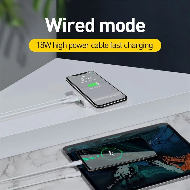 Small square black 10000mAh power bank with wireless charging symbol and digital display.