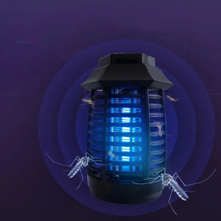 Black aromatherapy mosquito lamp insect killer with UV or LED tube on a table.