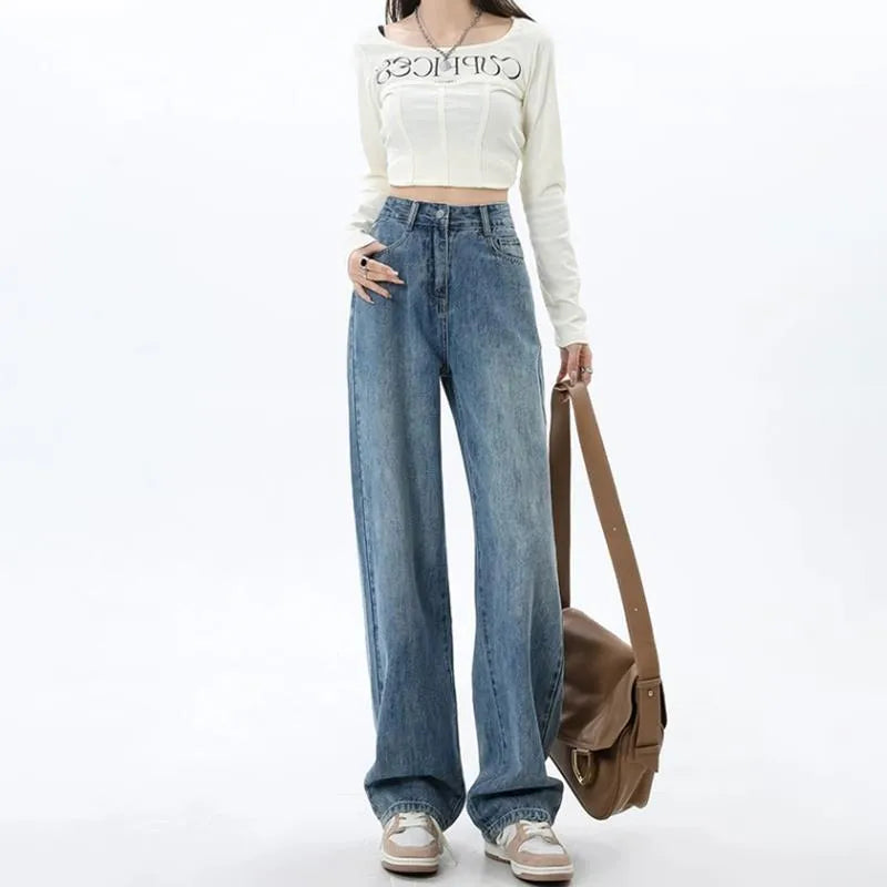 Women's retro blue high-waist wide-leg denim jeans on a hanger, showing the straight leg cut and front pockets.