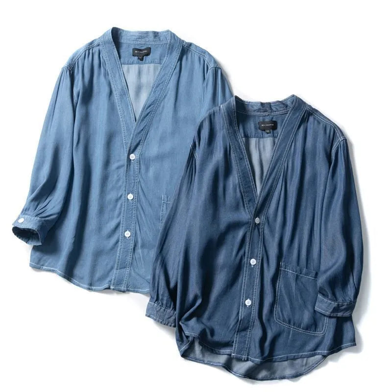 Men's dark blue three-quarter sleeve V-neck casual denim coat laid flat.