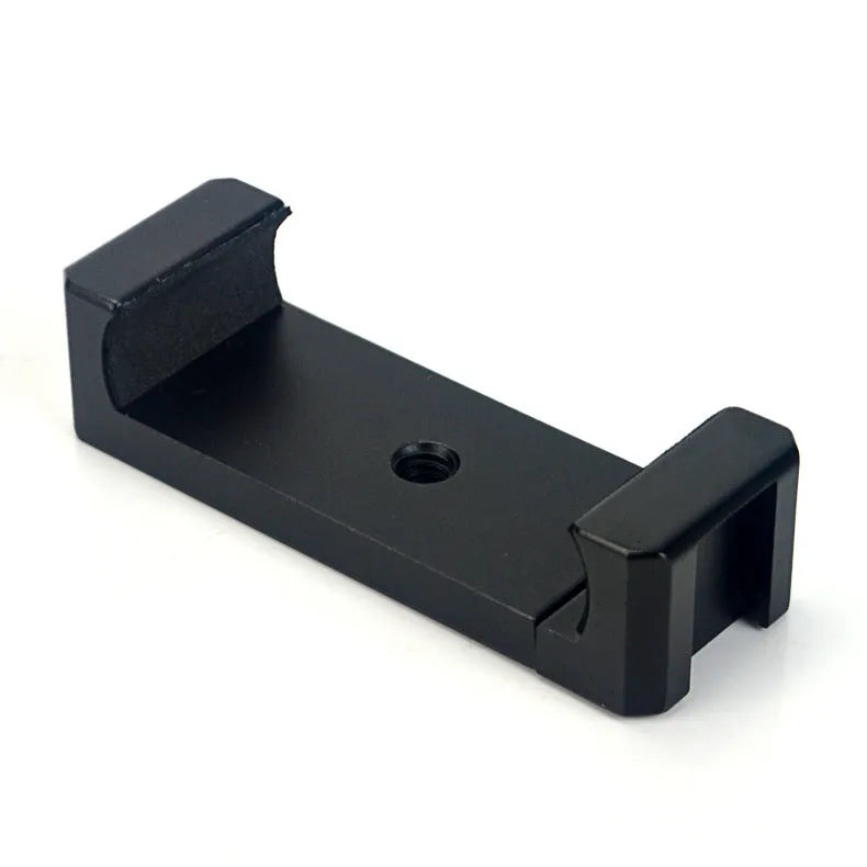 Aluminium alloy handheld bracket accessory for mounting an iPhone onto a table top tripod.